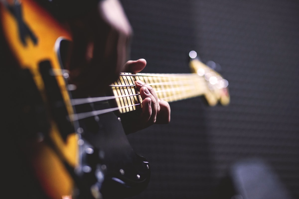Custom bass guitar being played in the studio