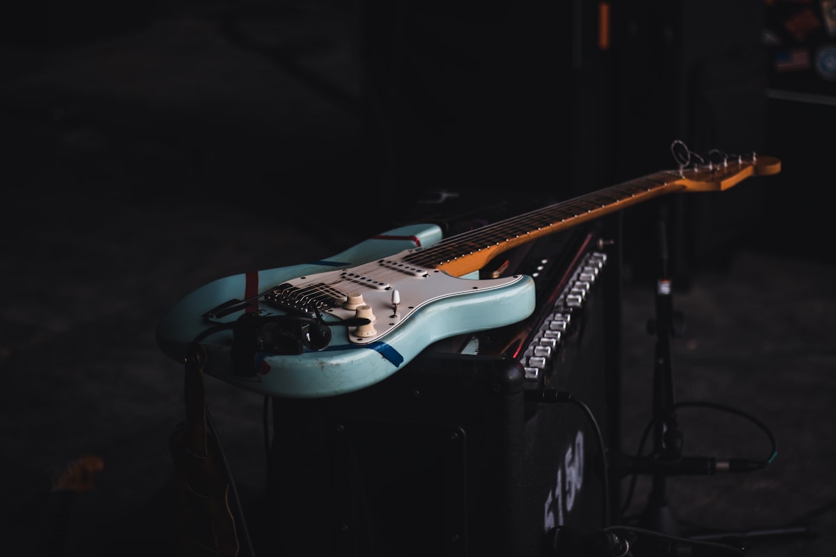Custom electric guitar resting on an amplifier