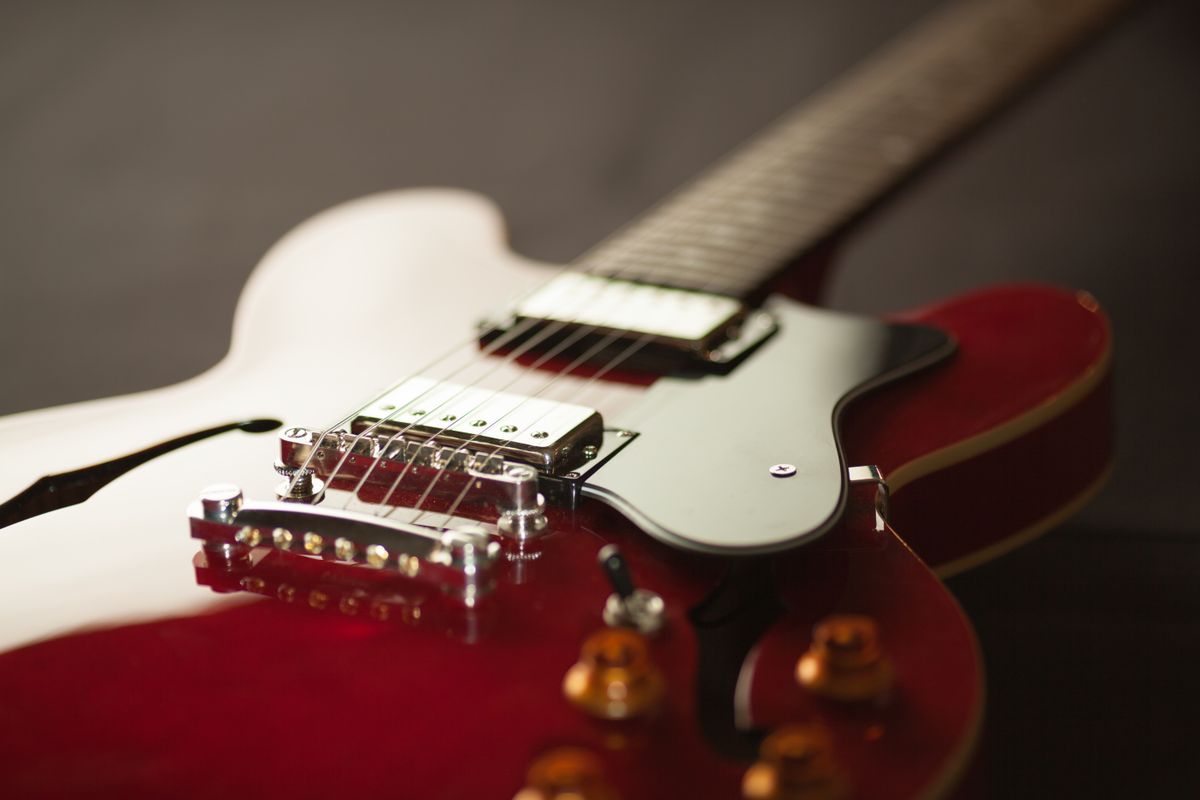 Cherry red custom electric guitar close-up